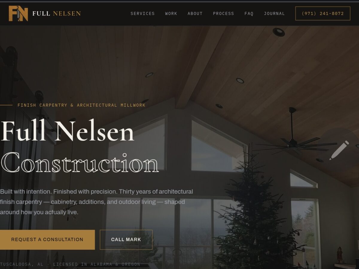 The Full Nelsen Construction home page with its FN mark, navigation, timber-framed interior photograph and consultation button.